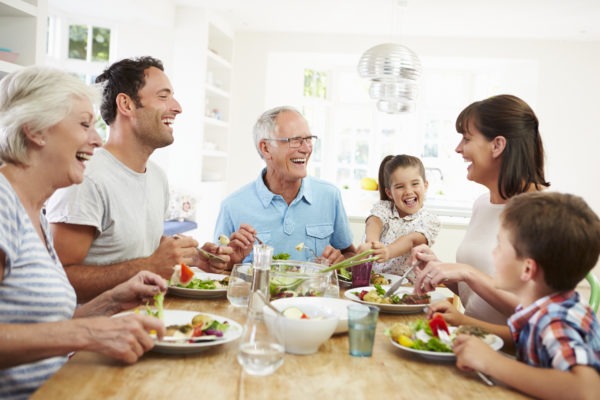 Family sitting at a table eating