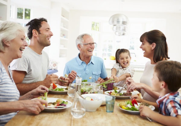 Family sitting at a table eating